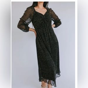 Shimmery black and gold midi dress, perfect for the holidays! Sheer arm detail.